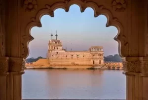 The stunning Lakhota Palace situated in the middle of Lakhota Lake, a premier historic highlight featured on our 2-day Jamnagar tour plan.