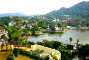 A breathtaking panoramic view of Nakki Lake nestled in the Aravalli hills of Mount Abu, the scenic hill station highlight of our 3-day interstate tour package.