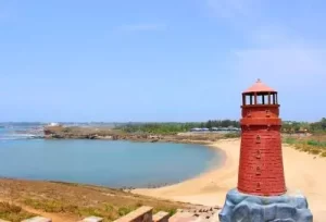 Visitors enjoying water sports and relaxation on the pristine sands of Nagoa Beach, a premier coastal highlight of our 3-day Diu leisure tour.