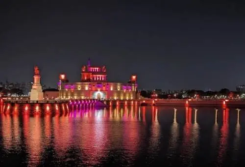 The beautifully illuminated Lakhota Fort situated on the lake in Jamnagar, a stunning architectural highlight featured in our customized Gujarat tour packages.