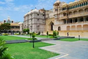 A stunning view from the courtyard of the City Palace in Udaipur, the majestic starting point for custom Rajasthan circular tour packages.